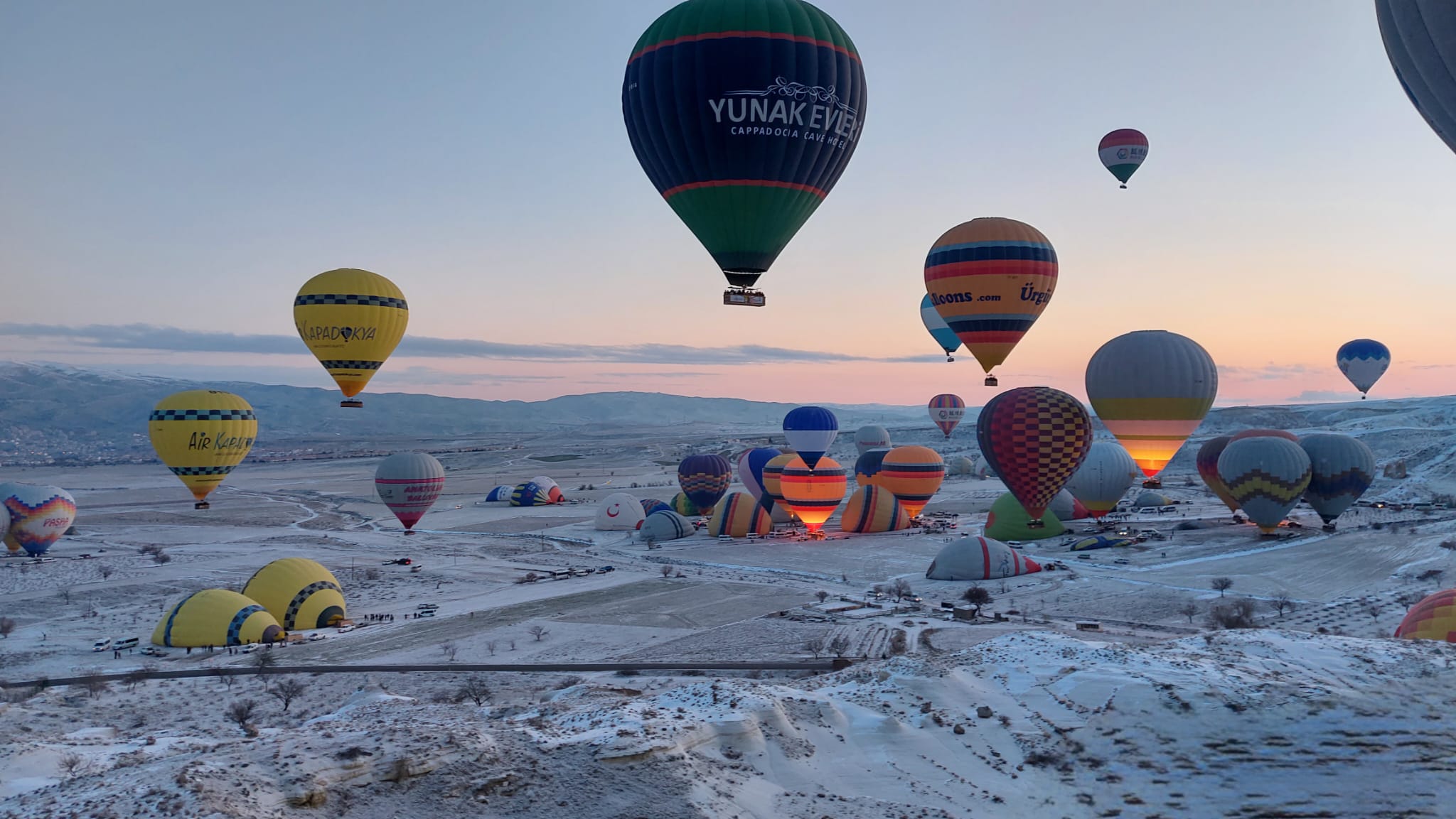 Aerial view of hot air balloons floating over Cappadocia