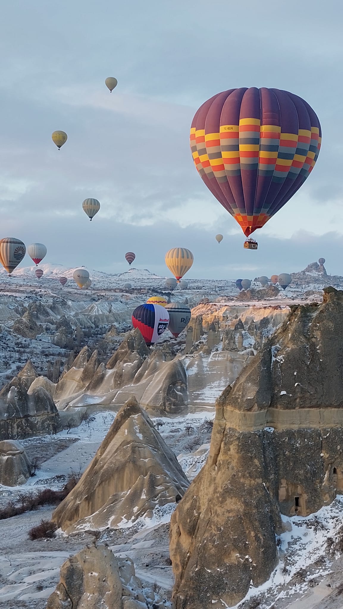 Hot air balloons floating over Cappadocia
